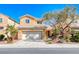 Charming two-story home with desert landscaping, two-car garage, and a welcoming facade under a clear blue sky at 7012 Mercurio Ave, Las Vegas, NV 89131