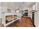 Bright kitchen with stainless steel appliances, light countertops, and pull out cabinet drawers at 7012 Mercurio Ave, Las Vegas, NV 89131