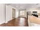 Bright kitchen with stainless steel appliances, modern countertops, and hardwood floors at 7012 Mercurio Ave, Las Vegas, NV 89131