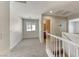 Upstairs loft with neutral carpet, good natural light, and a bathroom entrance at 7012 Mercurio Ave, Las Vegas, NV 89131