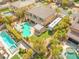 Expansive backyard features a sparkling pool, lush landscaping, outdoor kitchen, putting green, and ample patio space at 7354 Strutting Silver Ct, Las Vegas, NV 89131