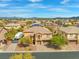 A sprawling community featuring many single Gathering homes nestled against a mountain range backdrop at 7354 Strutting Silver Ct, Las Vegas, NV 89131