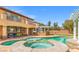 Backyard features a pool, spa, a built in outdoor kitchen and entertaining area, with a lush backyard at 7354 Strutting Silver Ct, Las Vegas, NV 89131