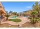 Backyard features a pool, spa, pergola, outdoor seating, mature landscaping, and a grass area at 7354 Strutting Silver Ct, Las Vegas, NV 89131