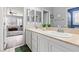 Dual sink bathroom featuring a view into the bedroom at 7354 Strutting Silver Ct, Las Vegas, NV 89131