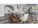 Dining room featuring stylish furniture, natural lighting, and wood-look floors at 7354 Strutting Silver Ct, Las Vegas, NV 89131