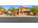 Charming two-story home featuring a three car garage, balcony, and desert landscaping at 7354 Strutting Silver Ct, Las Vegas, NV 89131