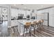 Modern kitchen with white cabinetry, large island, and stainless steel appliances at 7354 Strutting Silver Ct, Las Vegas, NV 89131