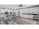 Bright kitchen with long countertops, large kitchen island and barstool seating at 7354 Strutting Silver Ct, Las Vegas, NV 89131