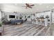 Open-concept living room and kitchen with modern finishes and stainless steel appliances at 7354 Strutting Silver Ct, Las Vegas, NV 89131