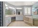 Luxurious main bathroom with dual vanity, soaking tub, and a glass shower at 7354 Strutting Silver Ct, Las Vegas, NV 89131