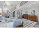 Bright main bedroom with walk-in closet, wood floors and a staircase at 7354 Strutting Silver Ct, Las Vegas, NV 89131