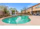 Beautiful backyard oasis featuring a large pool, spa, pergola, and outdoor seating for relaxation and entertainment at 7354 Strutting Silver Ct, Las Vegas, NV 89131