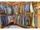 Spacious walk-in closet with custom built-in shelving providing ample storage for clothes, hats, and accessories at 7354 Strutting Silver Ct, Las Vegas, NV 89131