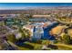 Beautiful aerial view of a Sun City Aliante recreation center, tennis courts, and surrounding community at 7849 Lily Trotter St, North Las Vegas, NV 89084