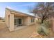 A covered patio and low-maintenance desert landscaping offer a relaxing outdoor space at 7849 Lily Trotter St, North Las Vegas, NV 89084