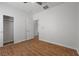 A bedroom with wood-look tile flooring, closet and a ceiling fan for added comfort at 7849 Lily Trotter St, North Las Vegas, NV 89084
