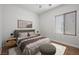 Well-lit bedroom with modern design, a comfortable bed, and sleek furniture at 7849 Lily Trotter St, North Las Vegas, NV 89084