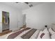 Minimalist bedroom with closet, neutral tones, and comfortable bedding at 7849 Lily Trotter St, North Las Vegas, NV 89084