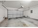 Spacious two car garage featuring an automatic door and ample room for storage and vehicles at 7849 Lily Trotter St, North Las Vegas, NV 89084