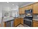 Contemporary kitchen featuring stainless steel appliances, granite counters, and a convenient breakfast bar at 7849 Lily Trotter St, North Las Vegas, NV 89084