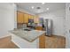 Well-appointed kitchen featuring granite countertops, stainless steel appliances, and wood cabinetry at 7849 Lily Trotter St, North Las Vegas, NV 89084