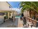 Inviting backyard with lush greenery, seating, patio and pool, perfect for outdoor living at 8073 Villa Pulido St, Las Vegas, NV 89131