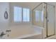 Clean bathroom featuring a shower and tub combination with window for natural light at 8073 Villa Pulido St, Las Vegas, NV 89131