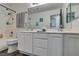 Bright bathroom featuring double sinks, white cabinetry, tub, and shower combination at 8073 Villa Pulido St, Las Vegas, NV 89131