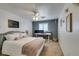Cozy bedroom featuring a bed, a work space, and a window at 8073 Villa Pulido St, Las Vegas, NV 89131