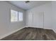 Inviting carpetless bedroom with closet, window, and white trim at 8073 Villa Pulido St, Las Vegas, NV 89131