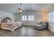 Serene main bedroom with vaulted ceiling, plantation shutters, and a sitting area at 8073 Villa Pulido St, Las Vegas, NV 89131