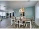 Formal dining room featuring a decorative chandelier and elegant chair and wainscoting details at 8073 Villa Pulido St, Las Vegas, NV 89131