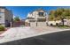 Lovely two-story home with three car garage, mature landscaping, and paved driveway at 8073 Villa Pulido St, Las Vegas, NV 89131