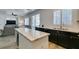 Bright kitchen with granite countertops, stainless appliances, and backyard access at 8073 Villa Pulido St, Las Vegas, NV 89131