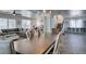 Open-concept home featuring a dining area, living room, and staircase with neutral color palette and wood-look floors at 8073 Villa Pulido St, Las Vegas, NV 89131