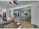 Open-concept living room with hardwood floors and dining area at 8073 Villa Pulido St, Las Vegas, NV 89131