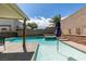 Sparkling swimming pool and spa with well-maintained backyard landscaping and privacy walls at 8073 Villa Pulido St, Las Vegas, NV 89131