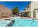 Sparkling pool and spa with covered patio, offering a serene backyard retreat for relaxation and entertainment at 8073 Villa Pulido St, Las Vegas, NV 89131