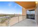 Balcony featuring sliding glass doors and desert views beyond the railing at 8255 Las Vegas Blvd # 802, Las Vegas, NV 89123