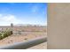 A balcony view of desert landscape with city buildings and mountains in the distance at 8255 Las Vegas Blvd # 802, Las Vegas, NV 89123