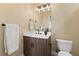 This powder room features a modern vanity, stylish mirror, and tile flooring at 8255 Las Vegas Blvd # 802, Las Vegas, NV 89123