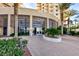 Building entrance featuring floor to ceiling windows and palm trees at 8255 Las Vegas Blvd # 802, Las Vegas, NV 89123