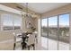 Bright dining room features large window views and a modern light fixture for stylish meals at 8255 Las Vegas Blvd # 802, Las Vegas, NV 89123