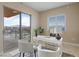 Bright home office with natural light boasts a desk and comfortable seating for productivity at 8255 Las Vegas Blvd # 802, Las Vegas, NV 89123