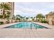 A large, well-maintained outdoor pool surrounded by palm trees and lounge chairs provides a resort-like living experience at 8255 Las Vegas Blvd # 802, Las Vegas, NV 89123