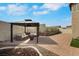 Cozy backyard with a covered gazebo, comfortable seating, and fire pit, perfect for gatherings and relaxation at 8287 Lincoln Valley St, Las Vegas, NV 89123