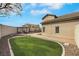 Spacious backyard with an outdoor gazebo, lush green lawn, and ample space for outdoor activities at 8287 Lincoln Valley St, Las Vegas, NV 89123