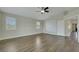 Spacious bedroom with hardwood floors, multiple windows, vaulted ceilings, and light walls at 8287 Lincoln Valley St, Las Vegas, NV 89123