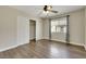 Bright bedroom features hardwood floors, closet, ceiling fan and window offering natural light at 8287 Lincoln Valley St, Las Vegas, NV 89123